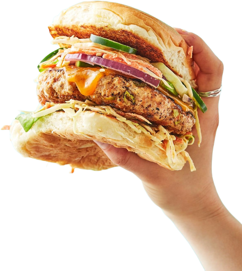 Hand holding hamburger